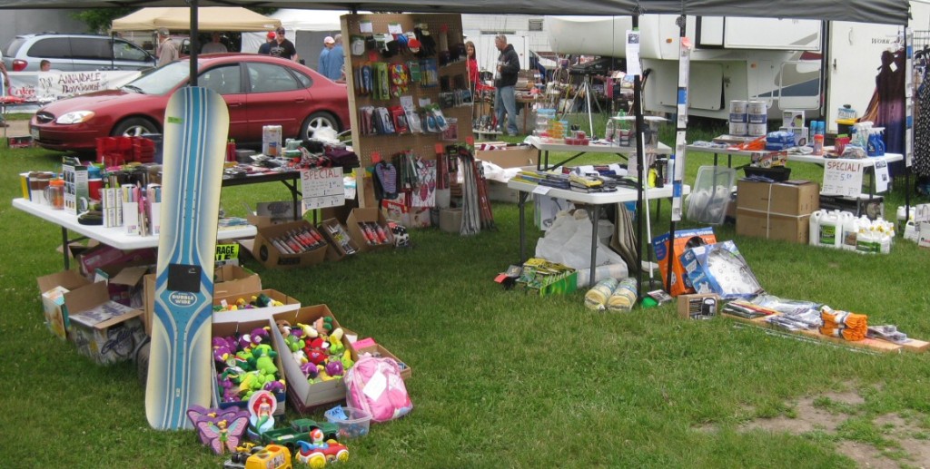 Our display tables at the flea market. 90% of the items for sale were Menards free-after-rebate items.